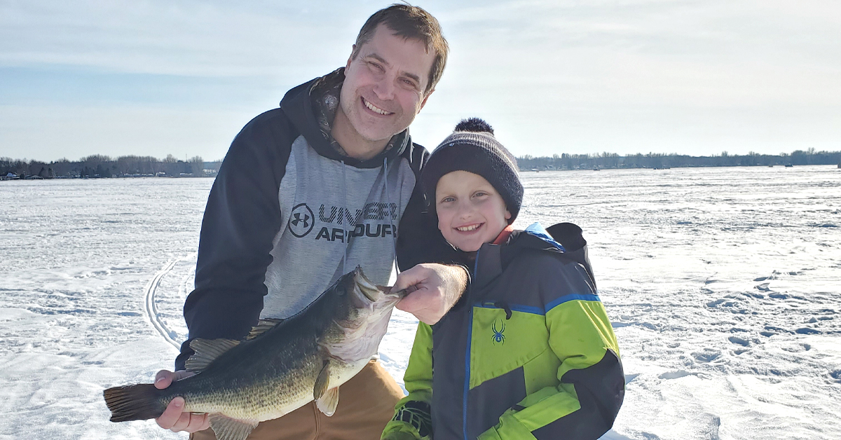 Dr. Michael Schnaubelt of BayCare Clinic poses with his son during an ice fishing trip.