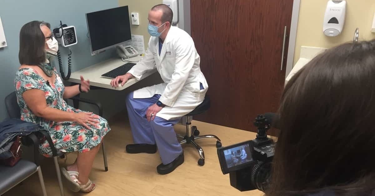 Dr. Gerald Eckardt of BayCare Clinic Neurological Surgeons chats with a patient