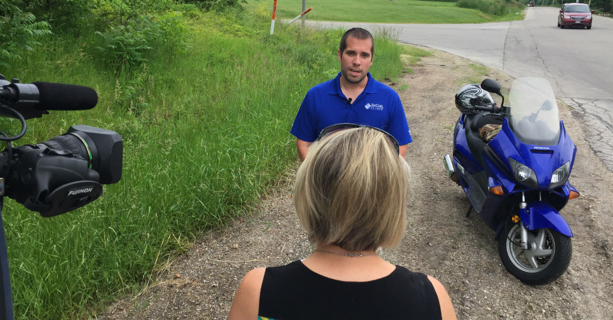 Dr. Bob Zemple talks with a television news reporter.