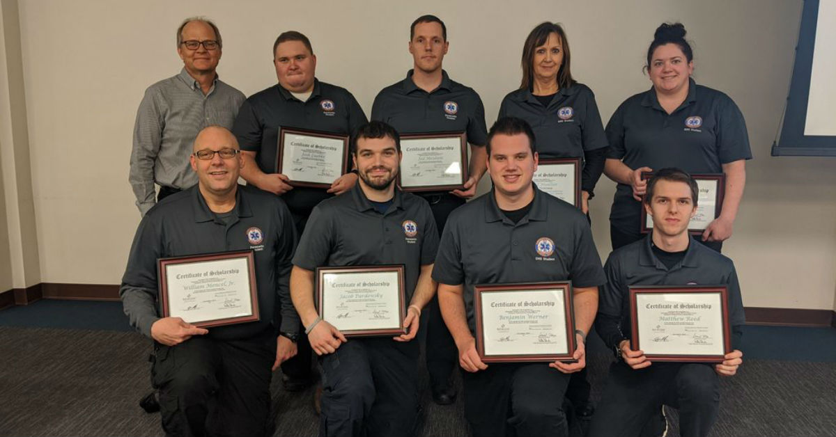 Eight NWTC EMS students and Dr. Christopher Sorrells