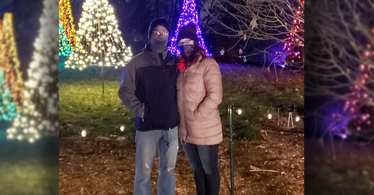 Amy Peterman in front of Christmas lights